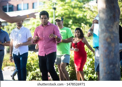 Washington, D.C. / USA - August 12, 2019: Latin Dancers Gather Outside Along The Georgetown Waterfront And Practice Their Bachata, Salsa, Zouk And Kizomba Dancing In A Public Park With A Speaker.