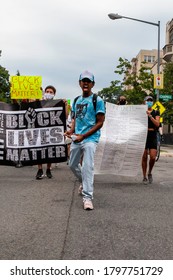 Washington, DC, USA - August 15, 2020: A Leader Of The Defund The Police March Leads Protesters In A Chant At The Beginning Of The March From Meridian Hill Park, Sponsored By DC Protests