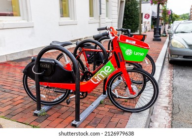 Washington DC, USA - August 18, 2021: M Street Parking Bicycle Rack For Lime Bike Bicycle Sign On Historic Street Red Brick Buildings In Georgetown