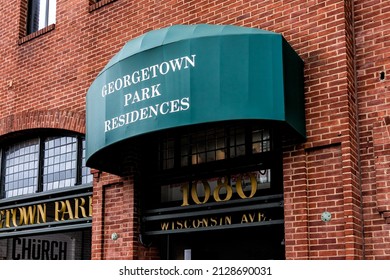 Washington DC, USA - August 18, 2021: M Street Wisconsin Avenue With Sign For Georgetown Park Residences And Public Parking Garage Park On Historic Brick Building With Nobody