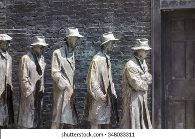 WASHINGTON DC, USA - AUGUST 20, 2014: An Art Installation At The Franklin Delano Roosevelt Memorial In Washington DC Shows A Bread Line Of Five Men To Commemorate The Great Depression Of The 1930s.