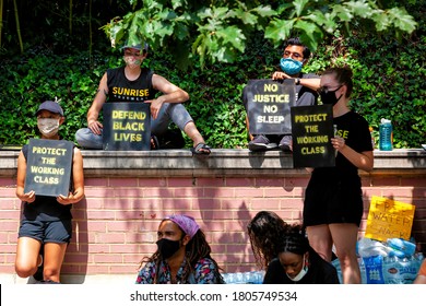 Washington, DC, USA - August 27, 2020. Sunrise Movement protesters hold signs for justice and protection for Black Lives and the working class at the Rally for Workers' Rights at Jeff Bezos' house