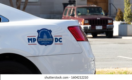 WASHINGTON, DC, USA - December 12, 2019: Seal Of The Metropolitan Police Department Of The District Of Columbia (Metro PD) On The Side Of Police Cruiser In Downtown Washington. 