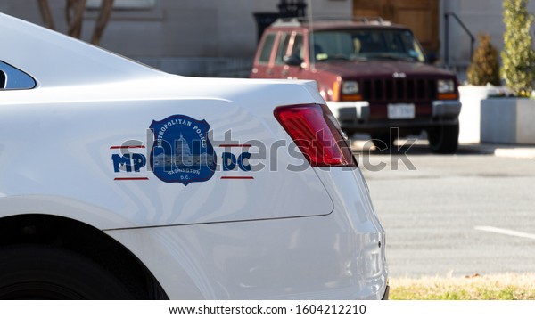 WASHINGTON, DC,\
USA - December 12, 2019: Seal of the Metropolitan Police Department\
of the District of Columbia (Metro PD) on the side of police\
cruiser in downtown Washington.\
