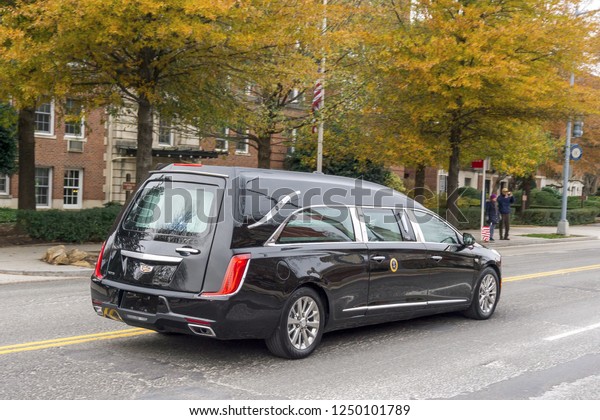 Washington, DC / USA -\
December 5, 2018: The hearse carrying the casket of President\
George H.W. Bush drives to the State Funeral at Washington National\
Cathedral.