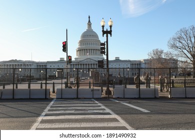 Washington, DC, USA - Jan. 10, 2020: A 7-foot tall security fence surrounds the U.S. Capitol building following the Capitol Hill riots on January 6.