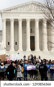 Washington, DC / USA - January 18, 2019: Pro Life And Pro Choice Protesters Stand Their Ground In Front Of The U.S. Supreme Court Over Roe V Wade In The Nationals Capital Washington DC. 