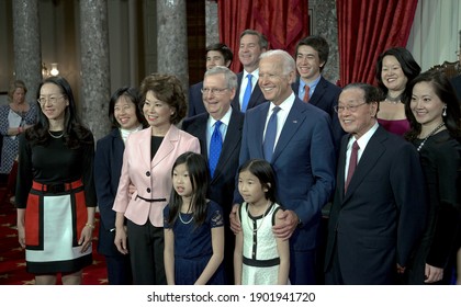 Washington DC, USA, January 6, 2015
Senate Majority Leader Senator Mitch McConnell (R-KY) and his wife Elaine Chao pose for pictures with their families and Vice President Joe Biden after being sworn 