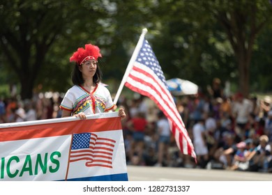 Washington, D.C., USA - July 4, 2018, The National Independence Day Parade, Taiwanese woman wearing traditional clothing , walking down constitution avenue