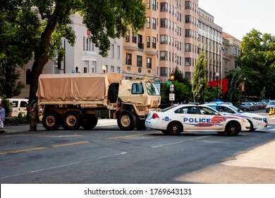 Washington, DC, USA - July 4, 2020: A National Guard Truck And DC Police Cars Block An Entrance To Black Lives Matter Plaza.  Trump Continues To Deploy DC National Guard Against Protesters.