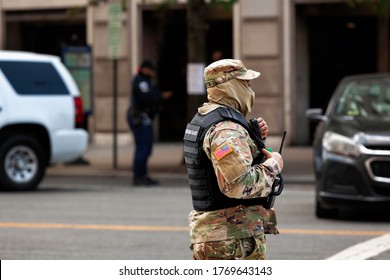 Washington, DC, USA - July 4, 2020: A DC National Guardswoman Stands At The Corner Of 14th And Vermont Streets In Sweltering Heat.  Trump Continues To Deploy DC National Guard Against Protesters