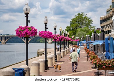 Washington, DC, USA - June, 10, 2021: Georgetown Waterfront Boardwalk During The Summer Season. 