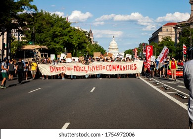 Washington, DC, USA - June 12, 2020: Protesters March Down Pennsylvania Avenue In Support Of Funding For Communities Instead Of Police, With The United States Capitol In The Background