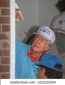 WASHINGTON, DC, USA - JUNE 18, 1992: President Jimmy Carter, Habitat For Humanity, Painting Door Frame During Project On Benning Road.