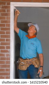 WASHINGTON, DC, USA - JUNE 18, 1992: President Jimmy Carter, Habitat For Humanity, Painting Door Frame During Project On Benning Road.