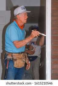 WASHINGTON, DC, USA - JUNE 18, 1992: President Jimmy Carter, Habitat For Humanity, Painting Door Frame During Project On Benning Road.