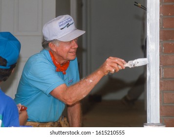 WASHINGTON, DC, USA - JUNE 18, 1992: President Jimmy Carter, Habitat For Humanity, Painting Door Frame During Project On Benning Road.