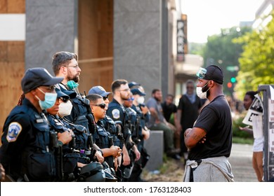 Washington, DC, USA - June 23, 2020: A Protester Talks With Police Officers Blocking Access To Lafayette Square, The Andrew Jackson Statue, And Part Of Black Lives Matter Plaza