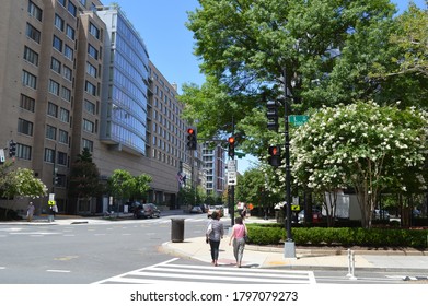 Washington D.C, DC/ USA - June 24 2015: people walking cross the street of 2100 St NW