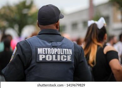 Washington, DC / USA - June 8, 2019: A police officer from the Metropolitan Police Department ensures public safety at the Capital Pride Parade.