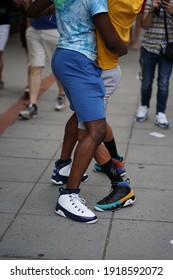 Washington, DC - USA - June 8, 2019: LGBT+ Gay Pride Parade On 17th Street NW In The Nation Capital. Close Up On The Legs Of Two African American Gay Men Dancing In A Sensual Manner.