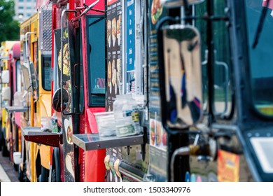 Washington DC, USA - June 9, 2019:  Parked And Lined Up Street Food Trucks In Washington DC. Selective Focus And Vintage Style.