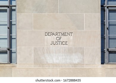 Washington D.C., USA - march 1, 2020: A sign of United States Department of Justice(DOJ) outside their headquarters building in Washington, D.C. USA.