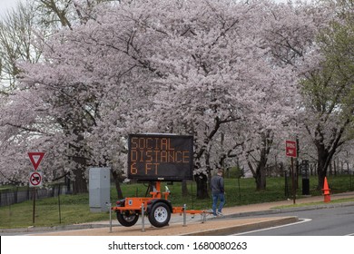 Washington, D.C. / USA - March 23, 2020: A Sign By The National Park Service Warns People To Stay 6 Feet Away From Each Other And Follow CDC Guidance To Prevent The Spread Of The COVID-19 Coronavirus.