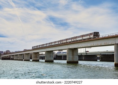 Washington, DC USA - March 23, 2016: Metro Train, The Local Subway System, Crossing The Potomac River On The Charles R. Fenwick Metro Transit Bridge, Part Of The 14th Street Bridge Complex