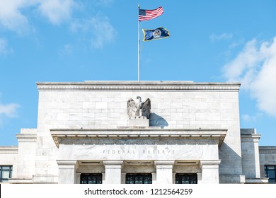 Washington DC, USA - March 9, 2018: Closeup Of Federal Reserve Bank Facade Entrance, Architecture Building, Eagle Statue American Flags, Blue Sky At Sunny Day