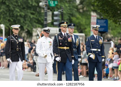 Washington, D.C., USA - May 28, 2018: The National Memorial Day Parade, Members Of Diferent Branches Of The United States Military In Uniform Marching Together Holding Swords