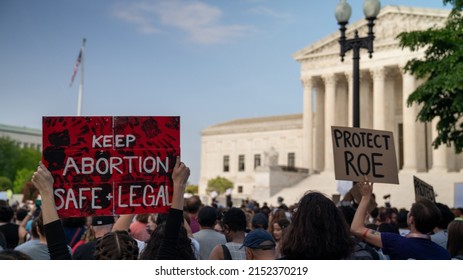 Washington, DC  USA May 3 2022: Protesters gather at the US Supreme Court after a report that the count will overturn Roe vs Wade, ending the constitutional right to abortion.
