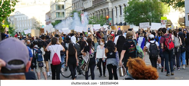 Washington, DC - USA - May 31, 2020: Black Lives Matter (BLM) Protest In Front Of The White House (Lafayette Square). Police Is Launching Tear Gas To The Crowd During The Early Evening. 