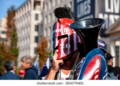 Washington, DC, USA - November 13, 2020: A Trump Supporter In A Trojan Helmet And Homemade Shield That Said 