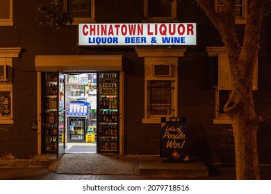 Washington DC, USA - November 14 2021: Liquor Store In Chinatown At Night. Door Opened Out To The Street. No Visible People.