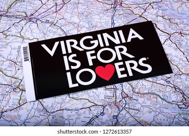 Washington, DC, USA - November, 21, 2018: Souvenir sticker - Virginia is for lovers - on road map surface. 
