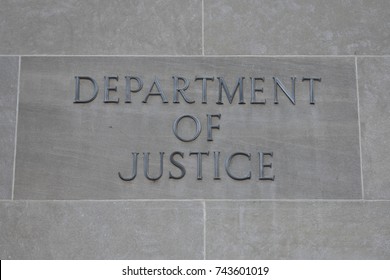 Washington D.C., USA Oct 23, 2017 : Department of Justice sign at the entrance to the United States of America Department of Justice building.   The Department of Justice is frequently in the news.