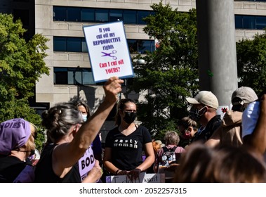 Washington, DC, USA - October 2, 2021: Woman Wearing “Nasty Woman” T-shirt Stands On Freedom Plaza At The Women’s March Facing The Counter Protesters Across The Street