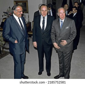 WASHINGTON DC, USA - OCTOBER 21, 1986
West German Chancellor Helmut Kohl, German Foreign Minister Hans-Dietrich Genscher, U.S. Secretary Of State George Shultz Pose For Group Photo Prior To Reception