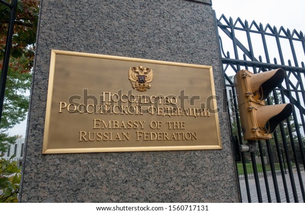 Washington, DC, USA - October, 22, 2019:\
Sign outside of Embassy of the Russian Federation (Russia) next to\
the light signal in Washington, DC, close up\
view