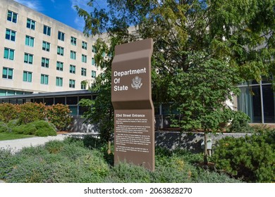 Washington, DC, USA - October 25, 2021: Brown U.S. Department Of State Sign For The 23rd Street Entrance With The State Department Building In The Background