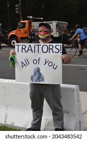 Washington, DC, USA - September 18, 2021: “Traitors All Of You,” Sign Held By A Male Protester Wearing A Wonder Woman Mask At The Justice For J6 Protest