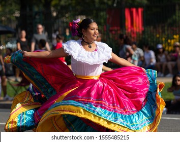 Washington DC, USA - September 21, 2019: The Fiesta DC, Costa Rican dancer wearing a traditional Guanacaste dress, dancing during the parade