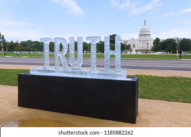 WASHINGTON DC, USA – SEPTEMBER 22, 2018: Truth Be Told, The Melting Ice Sculpture Exhibit On National Mall. The Message With The US Capitol On Background Is “Is Truth Melting Away?”