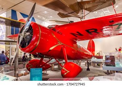 Washington DC, VA, USA - Dec 27th 2014: Amelia Earhart's Red Airplane. Impressive Unique Antique Plane Display