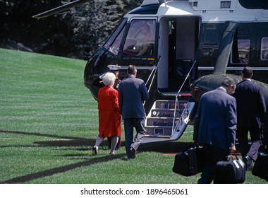 Washington, DC.USA, August 6, 1991 
President George H.W Bush and First Lady Barbara Bush walk towards to Marine One as they leave the White House to fly to Kennebunkport for their summer vacation.  