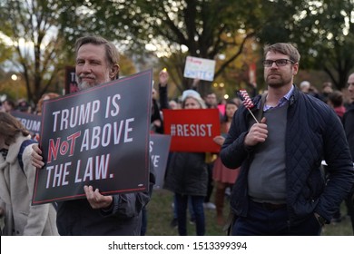       Washington, DC/USA – November 8, 2018: A demonstrator in Lafayette Square at the White House holds a sign reminding President Trump that he is not above the law.                         