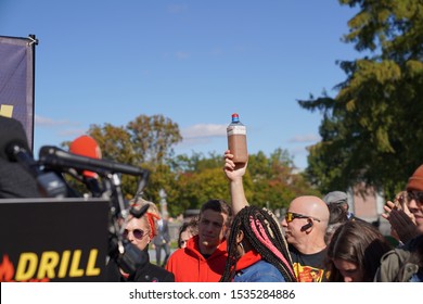 Washington, DC/USA – October 18, 2019: Fire Drill Friday Environmental Protest At The Capitol With A Protester Holding A Bottle Of Well Water Contaminated With Hydraulic Fracking Fluid.