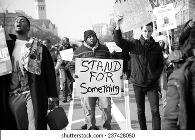 WASHINGTON - DECEMBER 13: Protesters march against police shootings and racism during a rally in  Washington, DC on December 13, 2014 