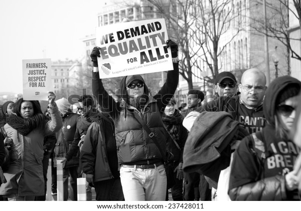 WASHINGTON - DECEMBER 13: Protesters march against\
police shootings and racism during a rally in  Washington, DC on\
December 13, 2014 